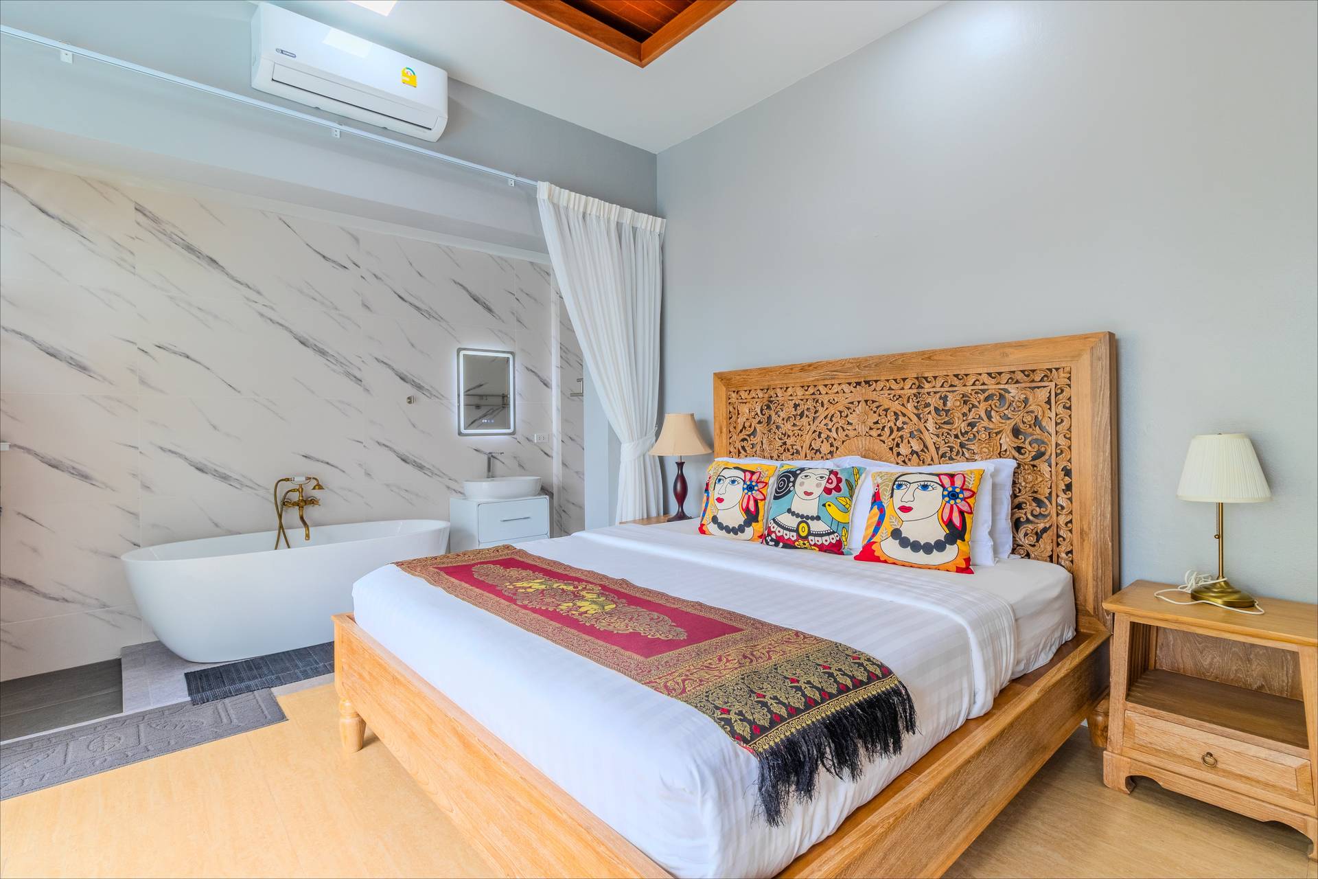Teak suite with carved headboard and bathtub