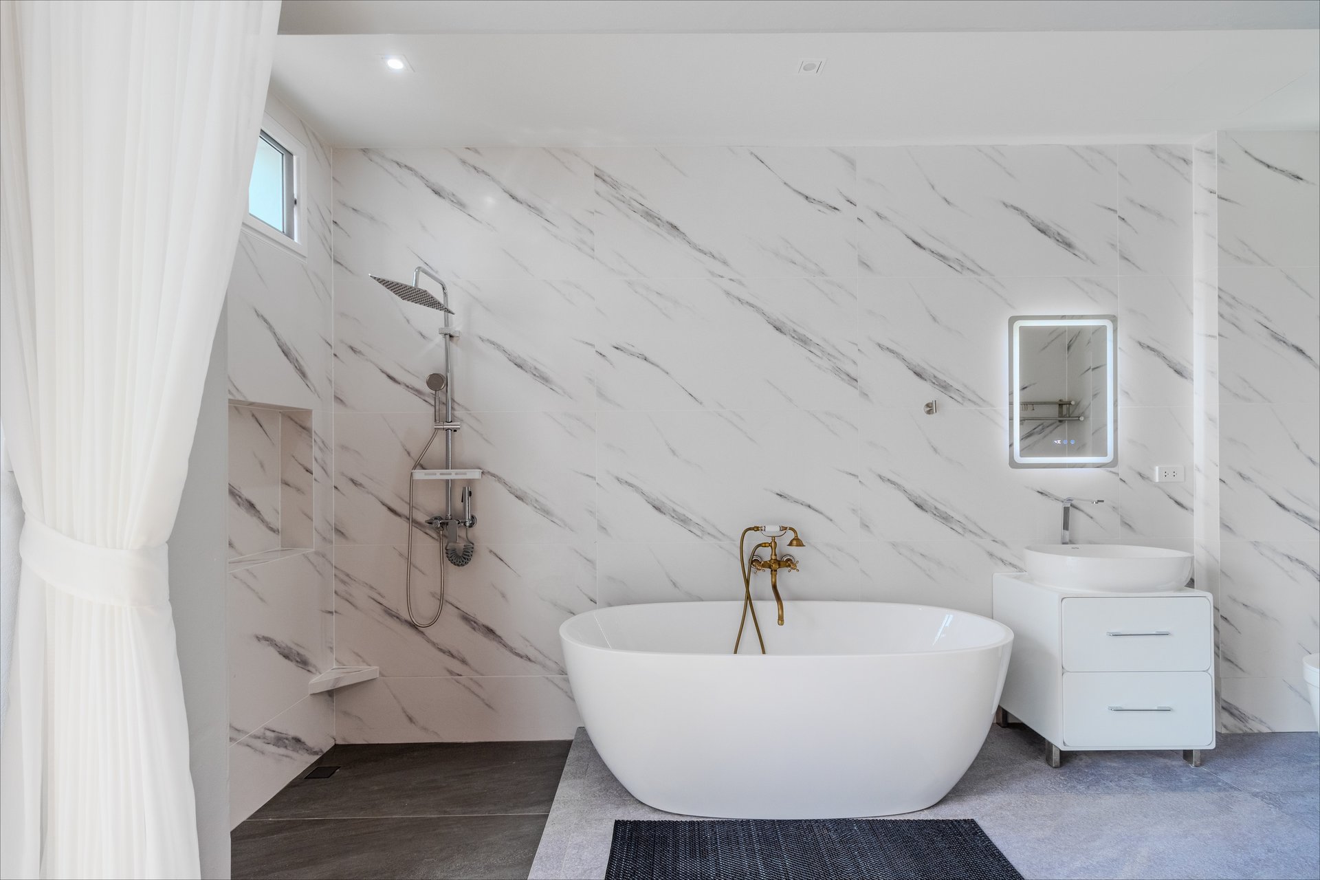 Marble bathroom with freestanding soaking tub