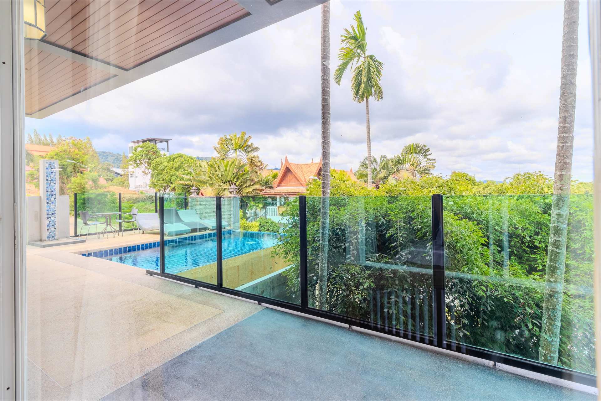 Rooftop infinity pool with sun loungers