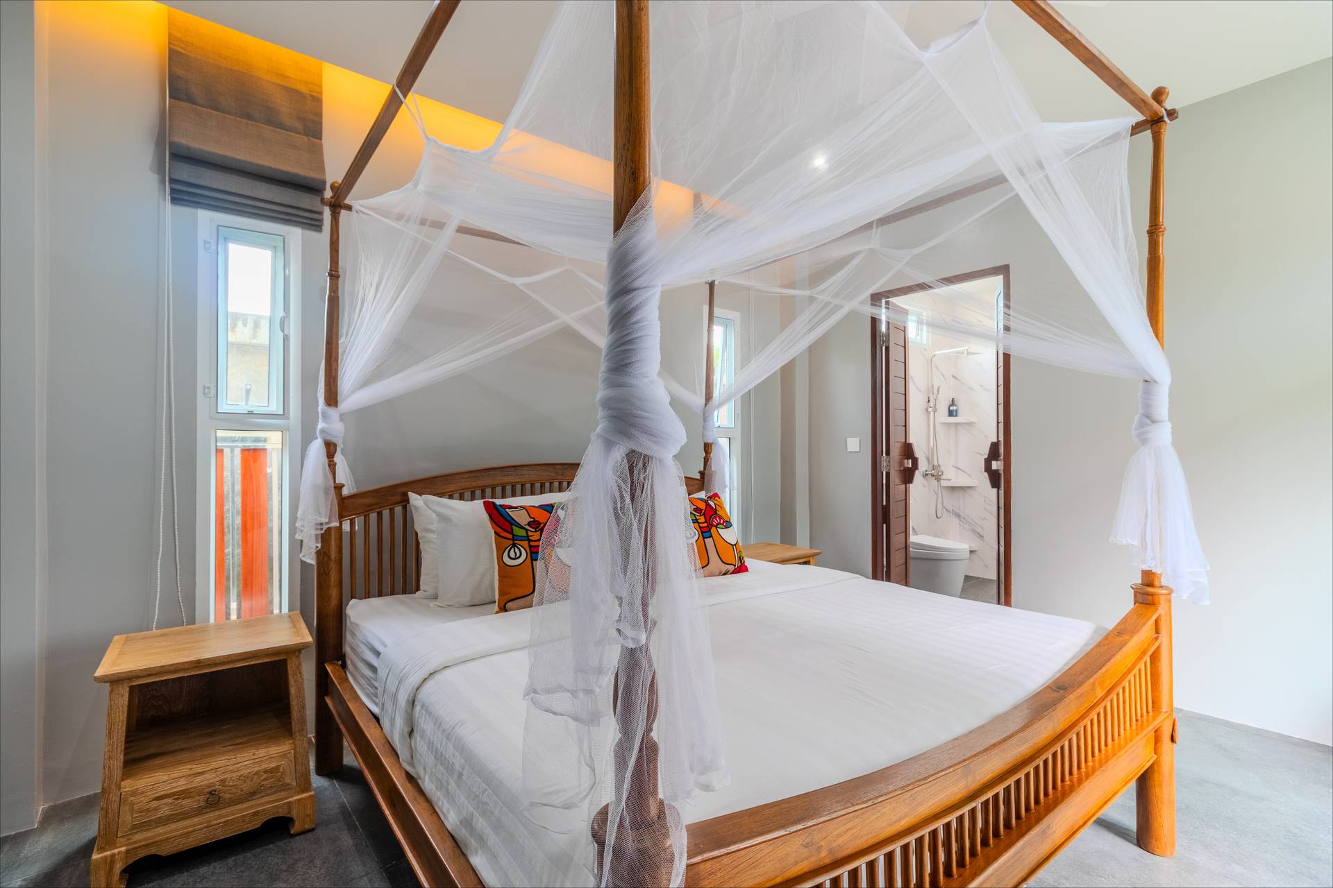 Canopy bed with marble bathroom and LED lighting