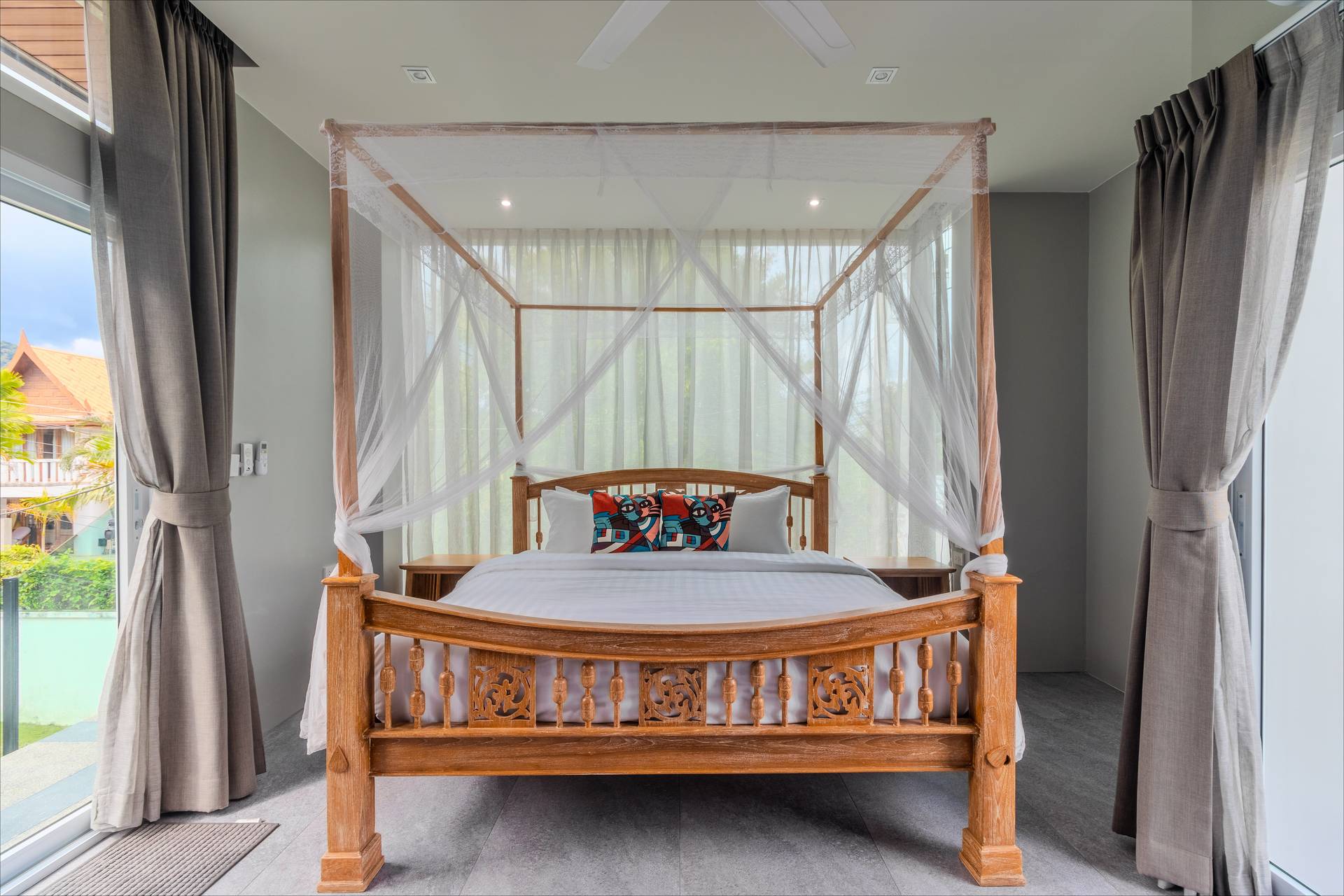 Elegant guest bedroom with tropical decor and modern amenities for group guests