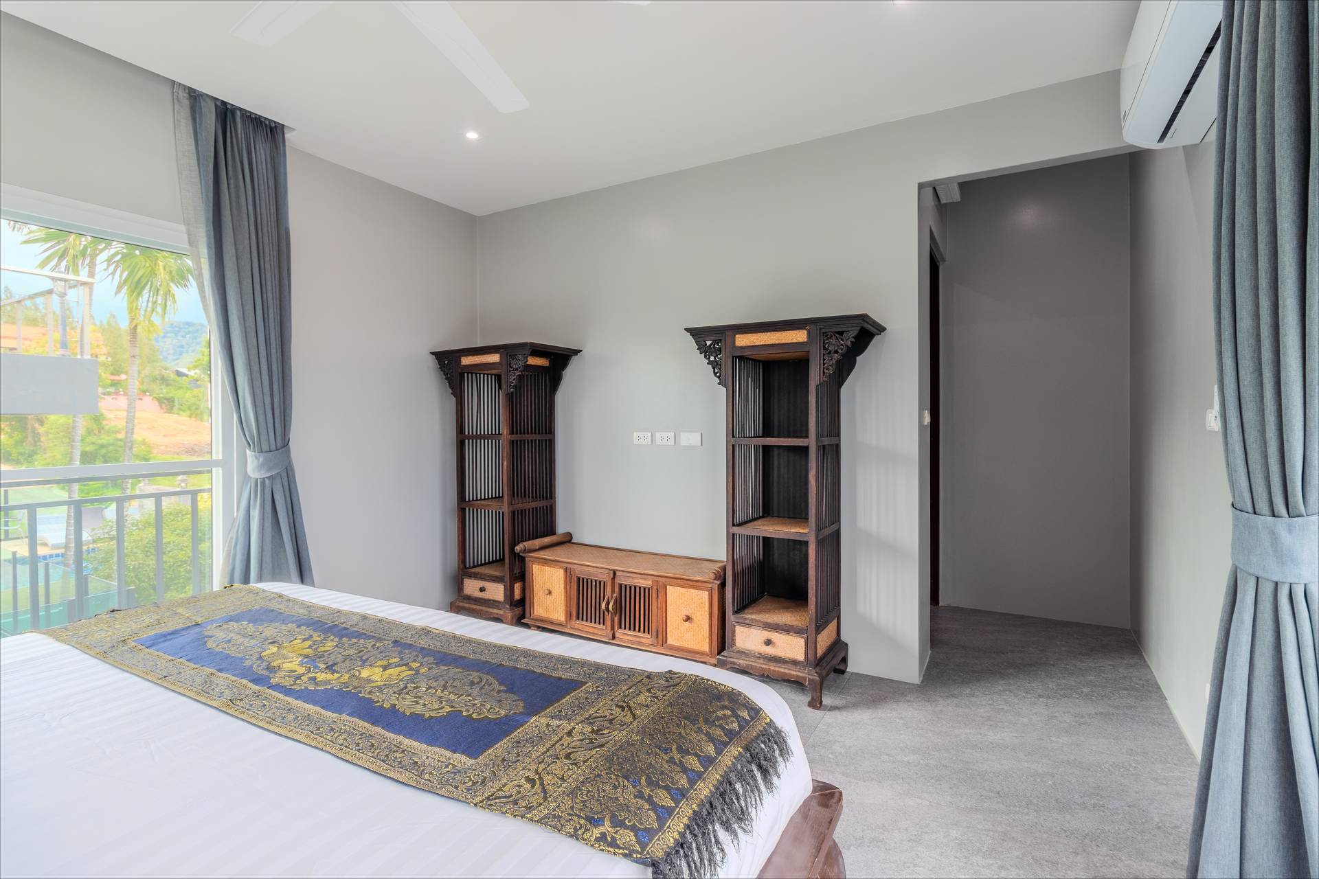 Bedroom with Thai silk runner and pool views