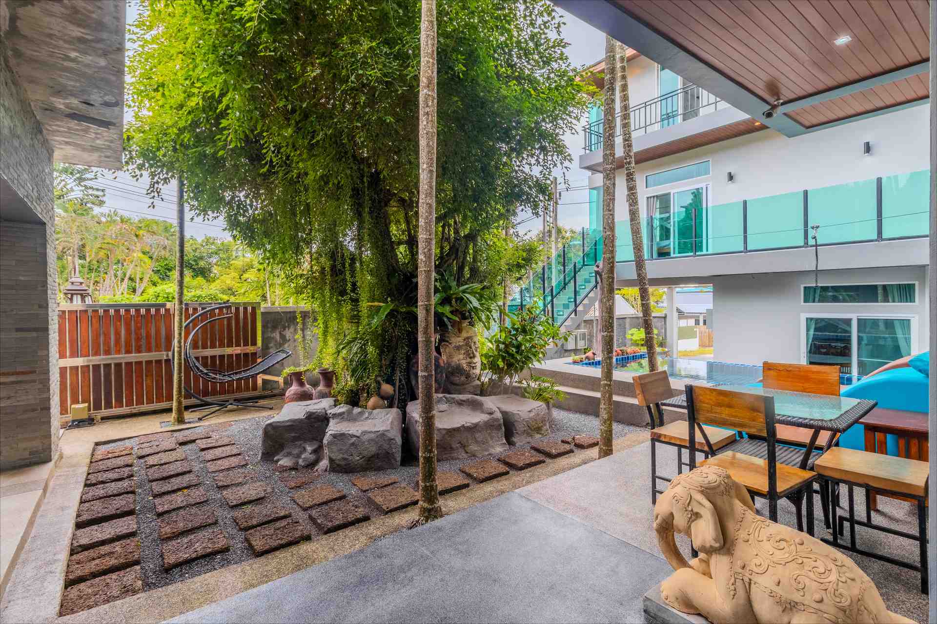Panoramic view of the villa estate surrounded by lush Rawai Phuket greenery