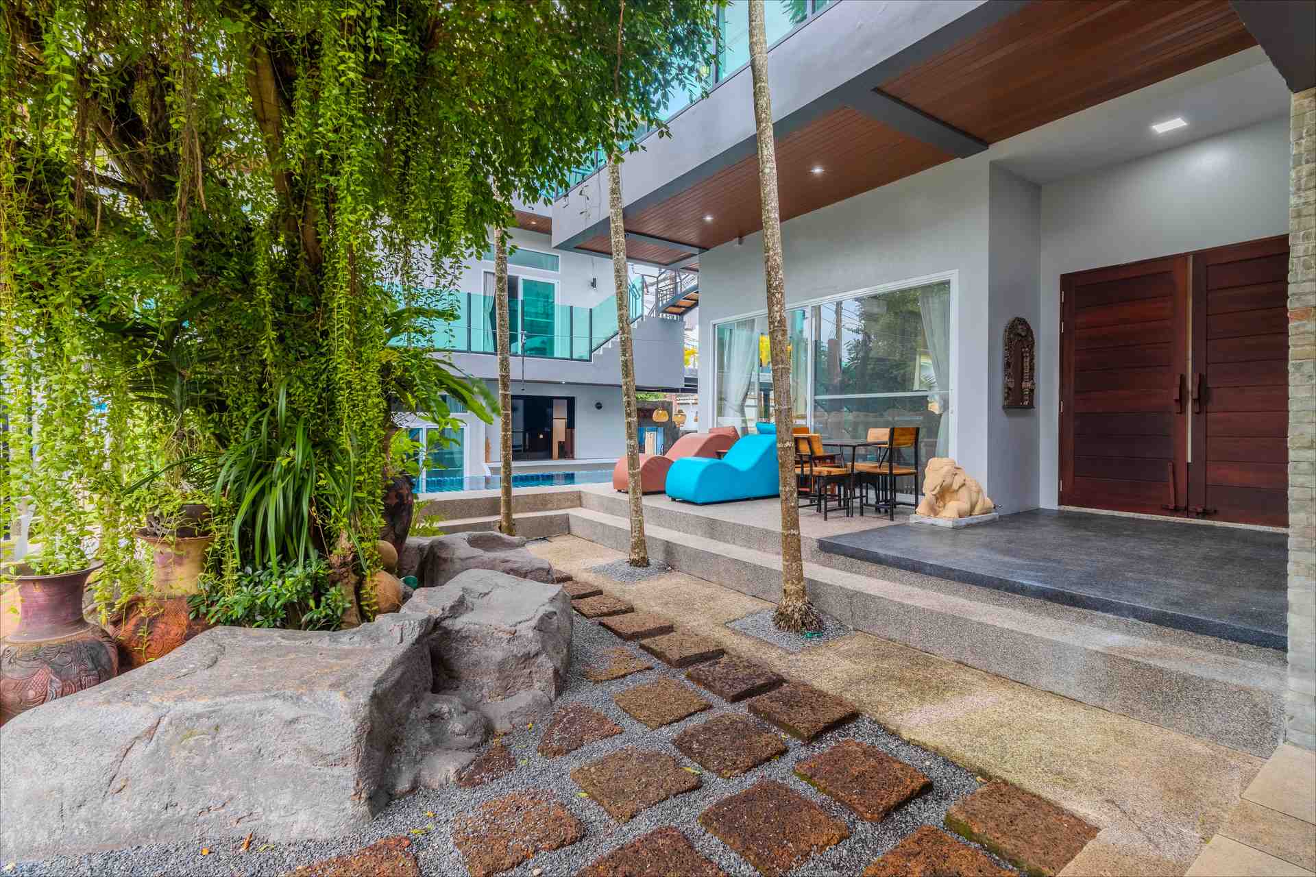 Courtyard with stone pathway and elephant sculptures