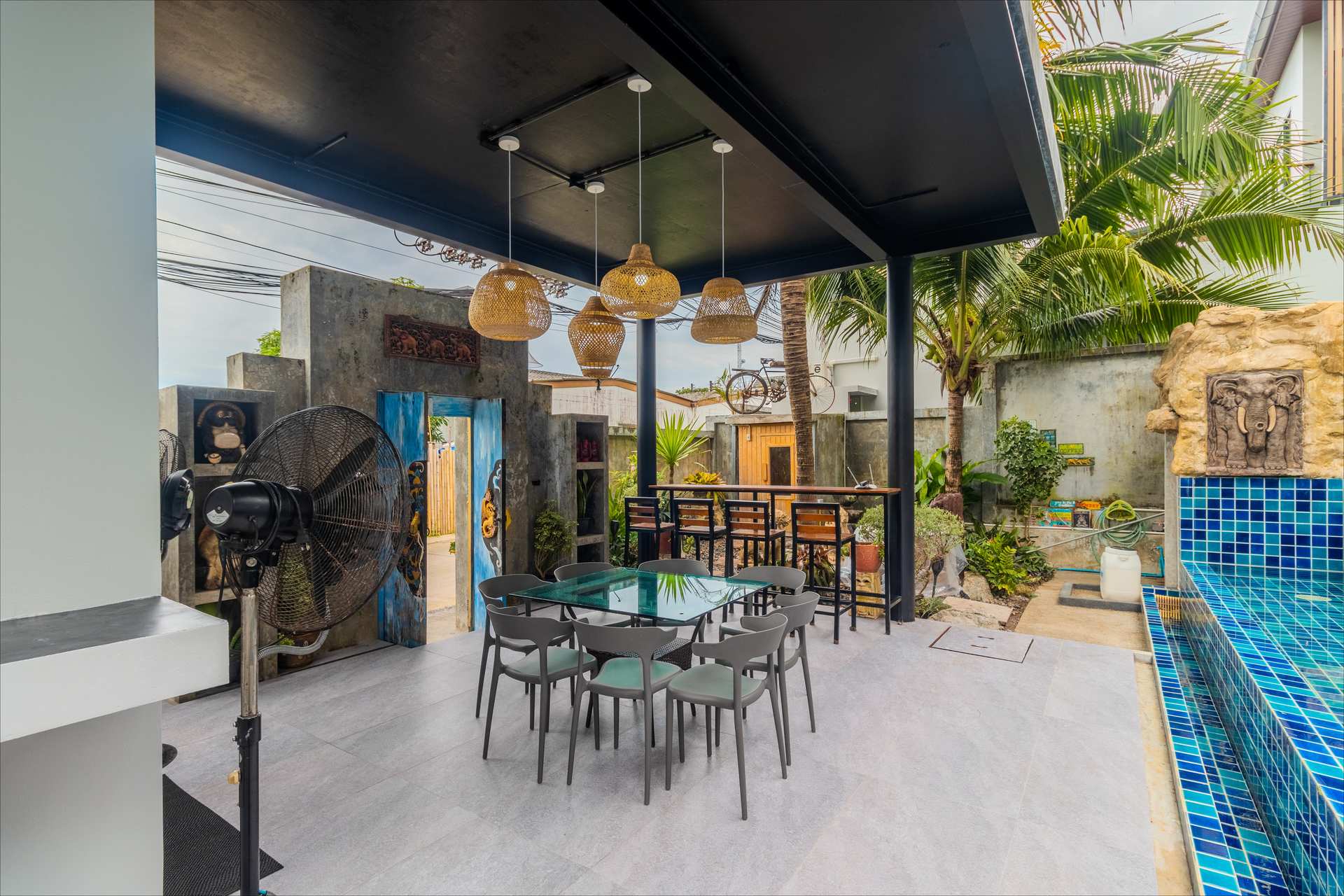 Outdoor dining with rattan pendant lights
