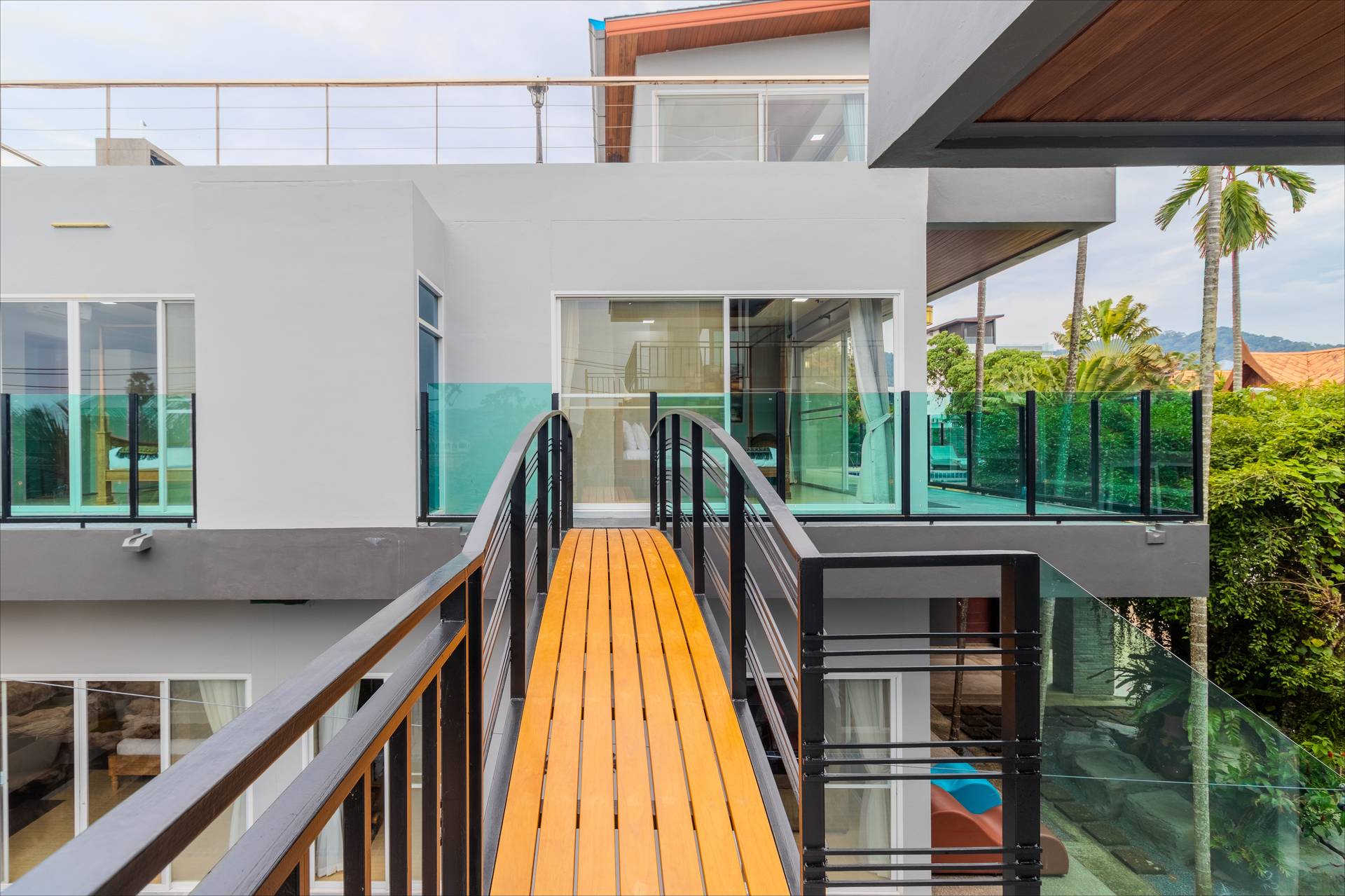 Sky bridge connecting villa buildings