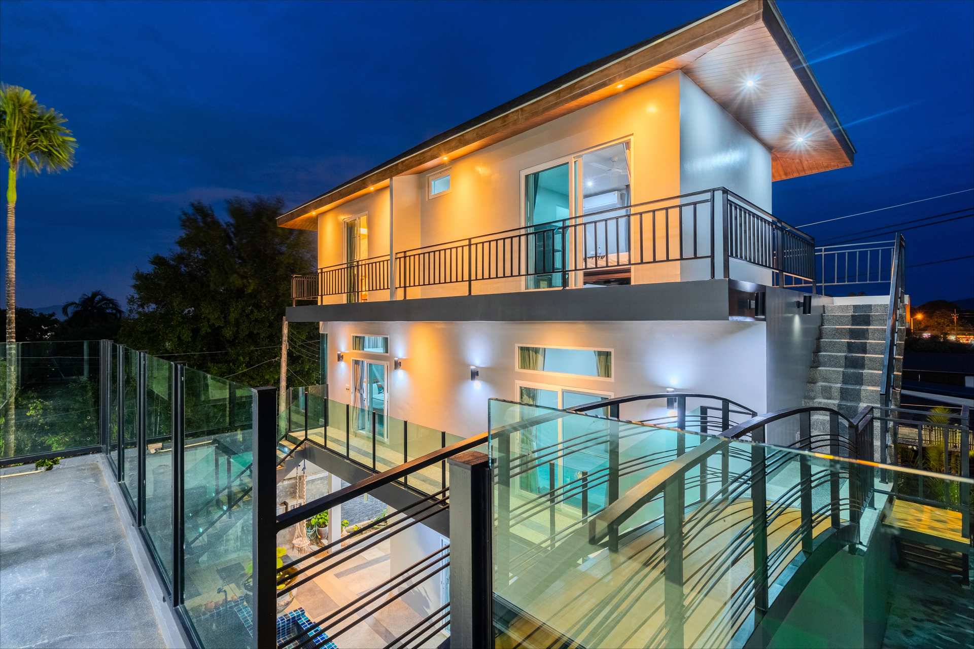 Villa entrance and tropical landscaping welcoming groups to the Phuket estate